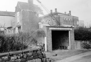 The building being demolished is Stanley's chemist in Madeley, circa 1968. This picture was shared by Frank Boden courtesy of Michael Stead, the great grandson of F G Stead of Madeley. The demolition of Madeley town centre began on January 31, 1968, starting with Madeley Rest Room, to make way for a new shopping centre. 