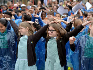 Supporting image for story: Primary school pupils belt out notes in annual city centre event
