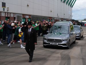 Supporting image for story: Fans applaud as Sir Tom Farmer’s hearse passes Easter Road