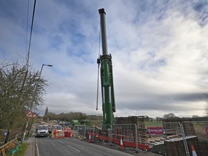  The giant crane being set up to move the beams.