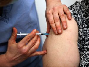 A patient receiving an injection of a vaccine