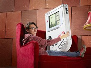 Supporting image for story: This student created the world’s largest Game Boy, and it’s certainly not handheld any more