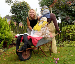 Sue Flavell pictured with her scarecrows