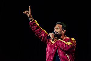 Craig David keeps spirits high during torrential downpours at V
