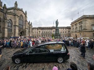 Supporting image for story: Hearse carrying coffin of Janey Godley showered with roses along Royal Mile