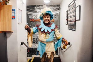 Zak Douglas shows off one of the many vivid costumes on display. Photo: Danny Kaan