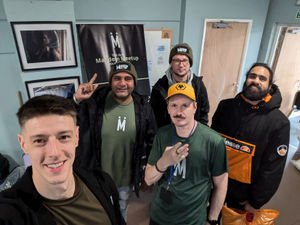 Leigh Edwards  (left) with one of the groups he works with at 
Mandem Meetup Wolves.