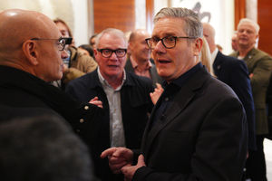 Prime Minister Sir Keir Starmer speaks to members of a business delegation in Beijing, with Richard Parker looking on