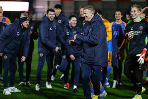 Joe Hart is encouraged to celebrate with the Salop fans