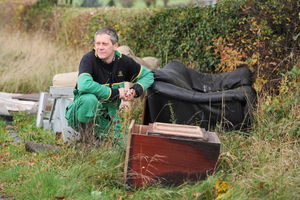 Chris Inett takes a look at rubbish dumped next to his land