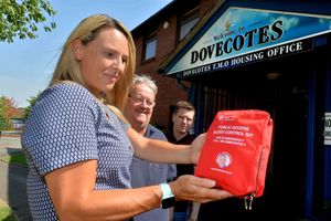 Dovecotes Housing Office, Pendeford, added a bleed kit to there derfibrillator box, chief officer Amie Merry, company secretary Andrew Slater and Councillor Adam Collinge..
