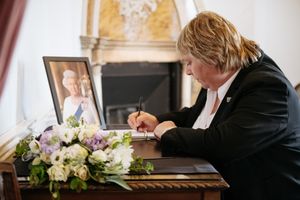Shropshire Council leader Lezley Picton signs the book of condolence at Shrewsbury Castle