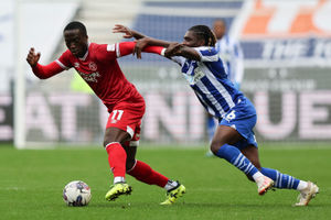 Dan Udoh of Shrewsbury Town and Babajide Adeeko of Wigan Athletic (AMA)