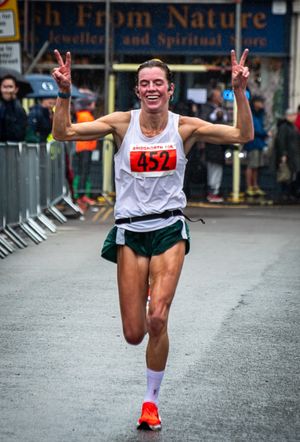 Giving the 'V' for victory was first lady home, Lindsay McCallum from Albrighton.