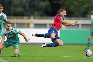 Mike Phenix of AFC Telford United is brought crashing down by Richard Marshall of Bradford Park Avenue