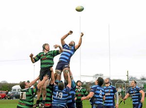Market Drayton RFC (Green) v Shrewsbury (Blue) at Greenfields, Market Drayton. Craig Wooley from Market Drayton watches Shrewsbury's James Plant make a grab for the ball. 