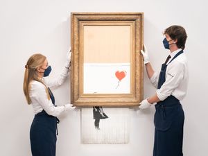Supporting image for story: Partially shredded Banksy painting sells for more than £18m