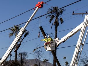 Energy power workers working on a power line