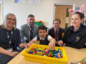 Sam, Neil, TA Ellie Green, and Deputy Head Boy Braden in the new building. 