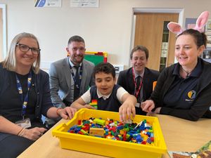 Sam, Neil, TA Ellie Green, and Deputy Head Boy Braden in the new building. 