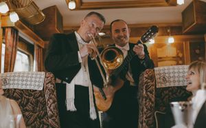 Music while you dine. The train's resident musicians serenade passengers