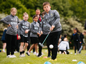 Supporting image for story: Primary school pupils teeing off at college's golf festival