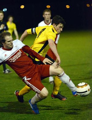 Ellesmere's Steve O' Reilly and Wem's Dan Price.
Elesmere in yellow