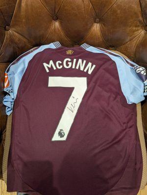 Adam was donated a signed shirt from Aston Villa's John McGinn
