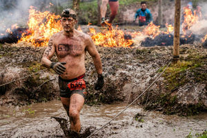Supporting image for story: Video and gallery: Hundreds brave fire, mud and barbed wire to take on Tough Guy challenge