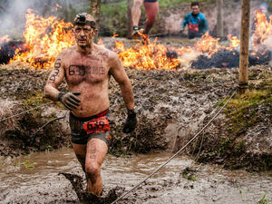 Supporting image for story: Video and gallery: Hundreds brave fire, mud and barbed wire to take on Tough Guy challenge