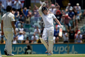 Australia's Mitchell Johnson (left) looks on as England's Ben Stokes (right) celebrates scoring 100 not out