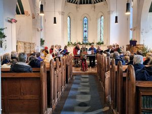 Kington Community Choir singing at the concert.