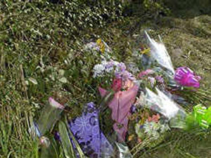 Supporting image for story: Floral tributes at scene of crash