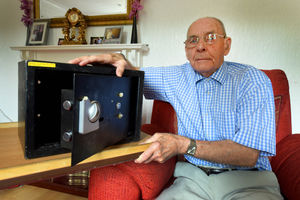 Roy Cooper with the safe retrieved from the canal