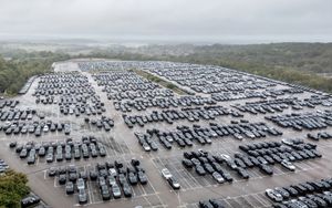 Aerial views capture hundreds of vehicles at Jaguar Land Rover's National Distribution Centre in Baxterley, Atherstone, Warwickshire.