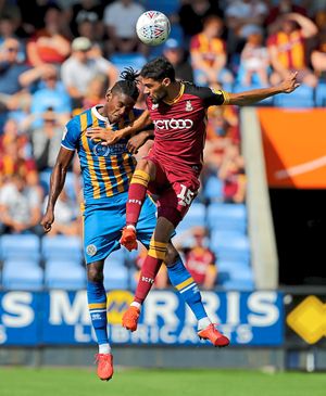 Kevin Mellor and Shrewsbury Town's Omar Beckles
