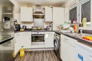 The kitchen has an integrated oven and hob