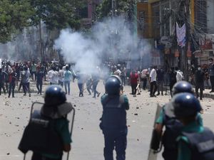 Supporting image for story: Bangladesh security forces fire bullets and sound grenades as protests escalate