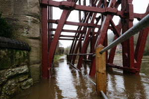 The footpath under the Iron Bridge is submerged