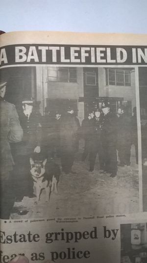 Officers guarding the entrance to Dunstall Road police station in Wolverhampton