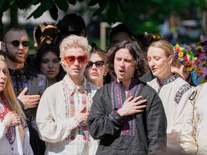 Eurovision band Ziferblat of Ukraine sing their national anthem with Ukrainian people during a family meeting in a park in Basel as part of the 69th Eurovision Song Contest week in Switzerland