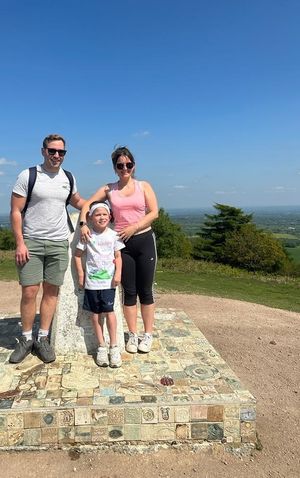 Oscar Smith at the top of Wrekin hill with dad Liam and mum Steph