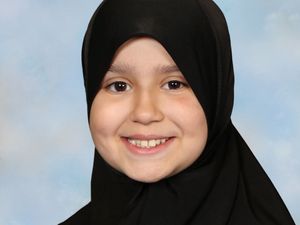 Handout photo of Sara Sharif smiling, wearing headscarf