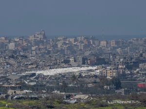 Tents are seen among the destroyed buildings in the Gaza Strip as seen from southern Israel