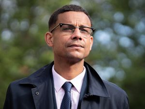 Head and shoulders photo of Daniel Kebede standing outside
