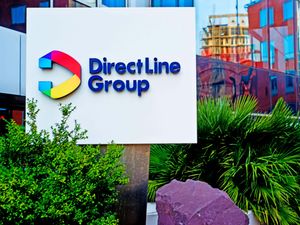 A Direct Line Group sign in front of the company's offices