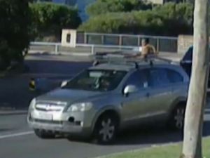 Supporting image for story: Four-year-old boy seen riding roof of moving car