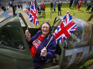 Annie Cherry sits in the Ulster Aviation Society’s replica Spitfire at Belfast City Hall to celebrate the 80th anniversary of VE Day
