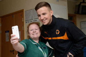 Nurse Sarah Maiden has a selfie with Lee Evans on the Oncology Ward