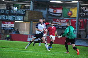 Goal! Dave Hibbert beats FC United keeper Dave Carnell to the ball to make it 3-1 to Telford.